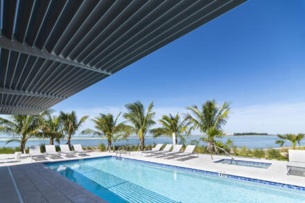 aluminum sunshade over pool with ocean view at ocean condominiums siesta key
