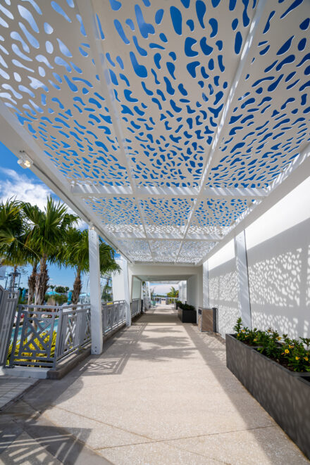 unique white aluminum walkway canopy with abstract cut outs