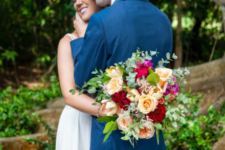 bridal flower bouquet with bride and groom on the powell crosley estate grounds